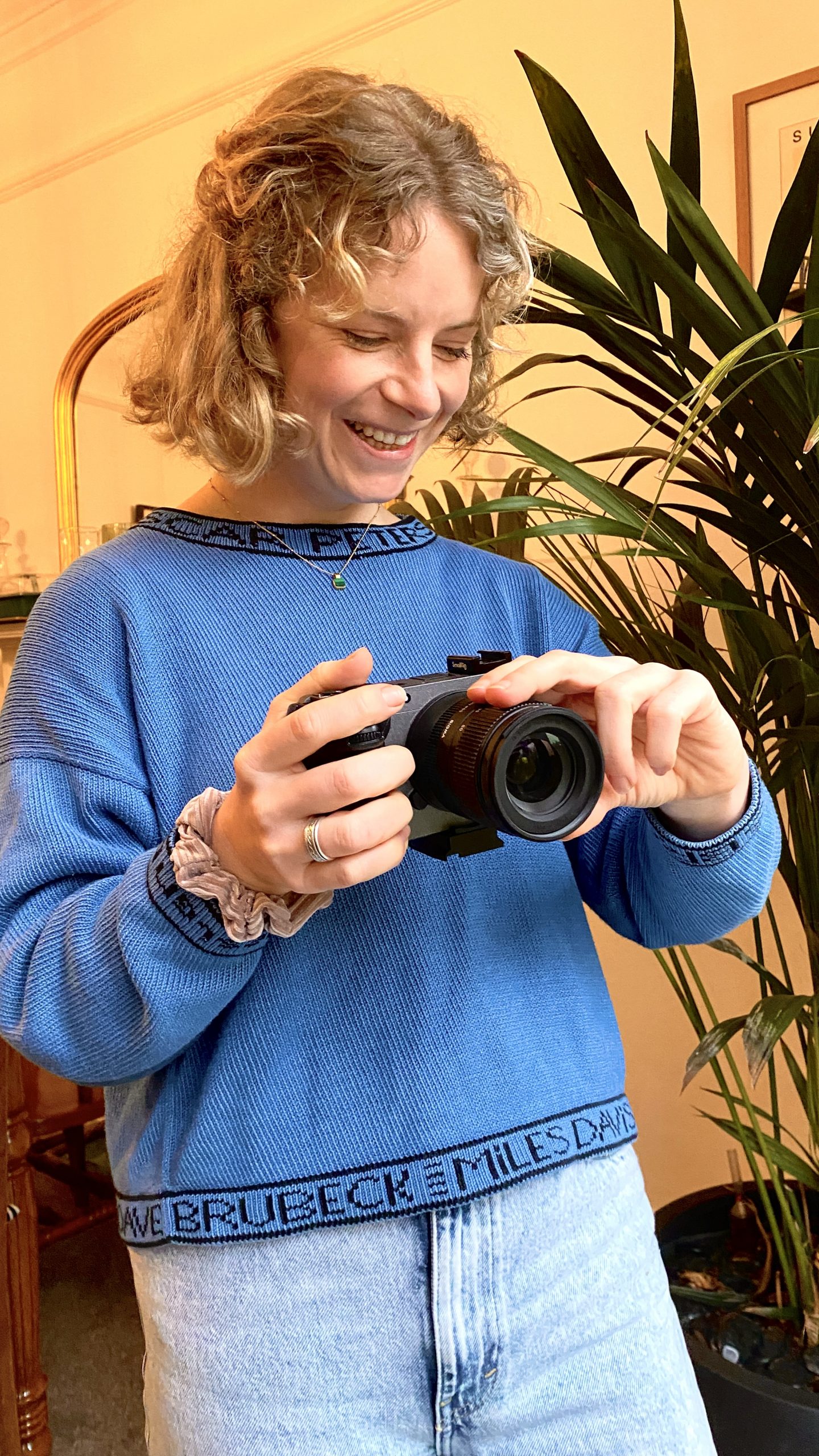 Videographer Marika Hoogenboom smiling whilst holding her Sony FX30 camera